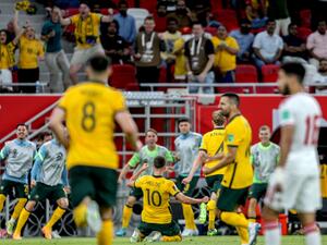 Australia's midfielder Ajdin Hrustic (C) celebrates after scoring his team's second goal during the FIFA World Cup 2022 play-off qualifier football match between UAE and Australia at Ahmad bin Ali stadium in Qatar's Ar-Rayyan city on June 7, 2022. (Photo by Mustafa ABUMUNES / AFP)