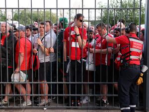 In this file photo taken on May 28, 2022 Liverpool fans stand outside unable to get in in time leading to the match being delayed prior to the UEFA Champions League final football match between Liverpool and Real Madrid at the Stade de France in Saint-Denis, north of Paris.  (Photo by THOMAS COEX / AFP)