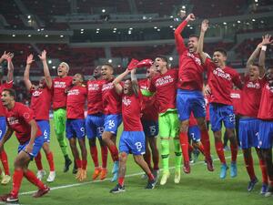 Costa Rica's players celebrate their win in the FIFA World Cup 2022 inter-confederation play-offs match between Costa Rica and New Zealand on June 14, 2022, at the Ahmed bin Ali Stadium in the Qatari city of Ar-Rayyan. Costa Rica beat New Zealand 1-0 to claim the last spot at this year's World Cup finals. (Photo by MUSTAFA ABUMUNES / AFP)