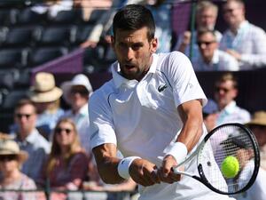 Serbia's Novak Djokovic returns the ball to Canada's Felix Auger-Aliassime during their men's exhibition singles match at The Giorgio Armani Tennis Classic tournament at the Hurlingham Club, in London, on June 22, 2022. (Photo by Adrian DENNIS / AFP)