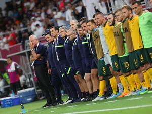 Australia's coach Graham Arnold (L) watches the penalty shootout during the FIFA World Cup 2022 inter-confederation play-offs match between Australia and Peru on June 13, 2022, at the Ahmed bin Ali Stadium in the Qatari city of Ar-Rayyan. (Photo by KARIM JAAFAR / AFP)