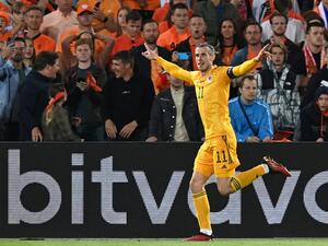 Wales' striker Gareth Bale celebrates after scoring his team's second goal during the UEFA Nations League - League A Group 4 football match between Netherlands and Wales at the Feyenoord "De Kuip" stadium in Rotterdam, on June 14, 2022. (Photo by JOHN THYS / AFP)