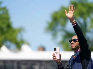Mercedes' British driver Lewis Hamilton waves to the crowd during the parade of drivers, ahead of the Canada Formula 1 Grand Prix on June 19, 2022, at Circuit Gilles-Villeneuve in Montreal. (Photo by Geoff Robins / AFP)