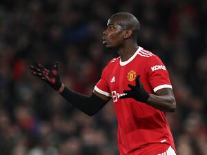 Manchester United's French midfielder Paul Pogba gestures during the UEFA Champions League round of 16 second leg football match between Manchester United and Atletico Madrid at Old Trafford stadium in Manchester, north west England on March 15, 2022. (Photo by Paul ELLIS / AFP)
