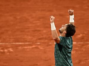 Norway's Casper Ruud reacts after winning against Croatia's Marin Cilic at the end of their men's semi-final singles match on day thirteen of the Roland-Garros Open tennis tournament at the Court Philippe-Chatrier in Paris on June 3, 2022. (Photo by Anne-Christine POUJOULAT / AFP)