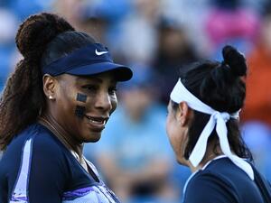 Serena Williams of the US (L) and Tunisia's Ons Jabeur react as they play against Japan's Shuko Aoyama and Taiwan's Chan Hao-ching during their women's doubles quarter final tennis match on day four of the Eastbourne International tennis tournament in Eastbourne, southern England on June 22, 2022. (Photo by Glyn KIRK / AFP)