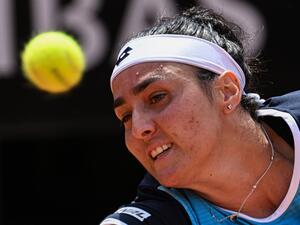 Tunisia's Ons Jabeur returns to Poland's Iga Swiatek during the final of the Women's WTA Rome Open tennis tournament on May 15, 2022 at Foro Italico in Rome. (Photo by Tiziana FABI / AFP)