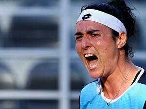 Tunisia's Ons Jabeur celebrates after defeating Greece's Maria Sakkari during their quarter finals match at the WTA Rome Open tennis tournament on May 13, 2022 at Foro Italico in Rome. (Photo by Tiziana FABI / AFP)