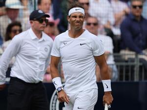 Spain's Rafael Nadal grimaces for hitting the ball out as he plays against Canada's Felix Auger-Aliassime during their men's exhibition singles match at The Giorgio Armani Tennis Classic tournament at the Hurlingham Club in London on June 24, 2022. (Photo by Adrian DENNIS / AFP)