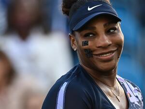 US player Serena Williams reacts as she plays with Tunisia's Ons Jabeur against Spain's Sara Sorribes Tormo and Czech Republic's Marie Bouzkova during their round of 8 women's doubles tennis match , on day three, of the Eastbourne International tennis tournament in Eastbourne, southern England on June 21, 2022. (Photo by Glyn KIRK / AFP)