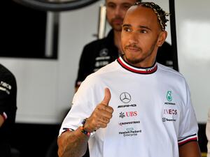 Mercedes' British driver Lewis Hamilton salutes the crowd in the pits during the first free practice session ahead of the French Formula One Grand Prix at Le Castellet circuit, southern France, on July 22, 2022. (Photo by Sylvain THOMAS / AFP)