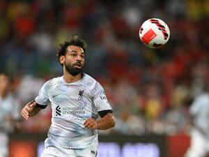 Liverpool's Egyptian forward Mohamed Salah looks towards the ball during the exhibition football match between English Premier League teams Manchester United and Liverpool FC at Rajamangala National Stadium in Bangkok on July 12, 2022. (Photo by MANAN VATSYAYANA / AFP)