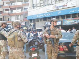 People outside a bank in Beirut 