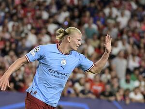 Manchester City's Norwegian striker Erling Haaland celebrates after scoring his team's third goal during the UEFA Champions League Group G first-leg football match between Sevilla FC and Manchester City, at the Ramon Sanchez Pizjuan stadium in Seville on September 6, 2022. (Photo by CRISTINA QUICLER / AFP)