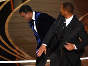 Will walked up to the stage and slapped the comedian across his face. 