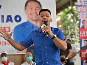 Manny Pacquiao, Philippine boxing legend and presidential candidate, speaks during a campaign stop ahead of the May 9 presidential election, in suburban Manila on February 16, 2022. (Photo by Ted ALJIBE / AFP)
