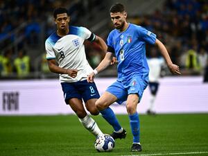 Italy's midfielder Jorginho (R) controls the ball as England's midfielder Jude Bellingham looks on during the UEFA Nations League's League A Group 3 match between Italy and England, at the San Siro Stadium in Milan on September 23, 2022. (Photo by Marco BERTORELLO / AFP)