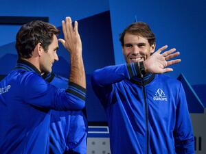Team Europe's players Roger Federer (L) and Rafael Nadal greets each other prior to the start of the 2019 Laver Cup tennis tournament in Geneva, on September 20, 2019. / AFP / Fabrice COFFRINI
