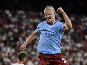 Manchester City's Norwegian striker Erling Haaland celebrates after scoring his team's third goal during the UEFA Champions League Group G first-leg football match between Sevilla FC and Manchester City, at the Ramon Sanchez Pizjuan stadium in Seville on September 6, 2022. (Photo by CRISTINA QUICLER / AFP)