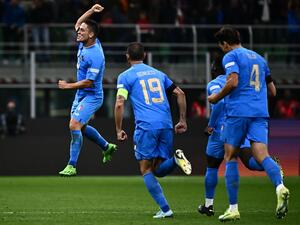 Italy's midfielder Giacomo Raspadori (L) celebrates after scoring a goal during the UEFA Nations League's League A Group 3 match between Italy and England, at the San Siro Stadium in Milan on September 23, 2022. (Photo by Marco BERTORELLO / AFP)