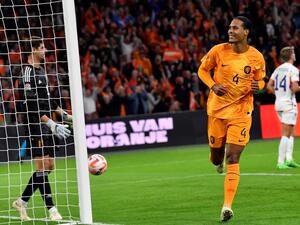 Netherlands' defender Virgil van Dijk (R) celebrates after scoring a goal during the UEFA Nations League's League A Group 4 football match between The Netherlands and Belgium, at Johan Cruyff ArenA in Amsterdam on September 25, 2022. (Photo by JOHN THYS / AFP)