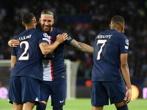 Paris Saint-Germain's French forward Kylian Mbappe (R) celebrates scoring the 2-0 goal with Paris Saint-Germain's Moroccan defender Achraf Hakimi (L) and Paris Saint-Germain's Spanish defender Sergio Ramos (C) during the UEFA Champions League Group H first leg football match between Paris Saint-Germain (PSG) and Juventus at Parc des Princes Stadium in Paris, on September 6, 2022. (Photo by FRANCK FIFE / AFP)