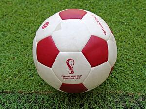 A view shows a ball with the logo of the Qatar 2022 World Cup at the Lusail Stadium on the outskirts of Qatar's capital Doha on August 15, 2022. (Photo by MUSTAFA ABUMUNES / AFP)