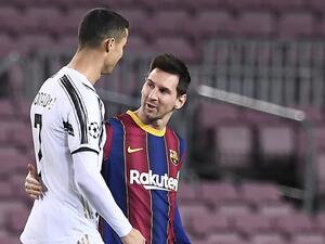 Juventus' Portuguese forward Cristiano Ronaldo greets Barcelona's Argentinian forward Lionel Messi (R) before the UEFA Champions League group G football match between Barcelona and Juventus at the Camp Nou stadium in Barcelona on December 8, 2020. / AFP / Josep LAGO