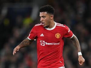 Manchester United's English striker Jadon Sancho runs with the ball during the UEFA Champions League round of 16 second leg football match between Manchester United and Atletico Madrid at Old Trafford stadium in Manchester, north west England on March 15, 2022. (Photo by Paul ELLIS / AFP)