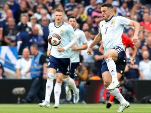 Scotland's midfielder John McGinn (R) controls the ball during the UEFA Nations League, league B group 1 football match between Republic of Ireland and Scotland at Aviva stadium in Dublin, Ireland on June 11, 2022. (Photo by Paul Faith / AFP)