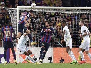 Barcelona's Polish forward Robert Lewandowski scores his team's third goal during the UEFA Champions League 1st round, group C, football match between FC Barcelona and Inter Milan at the Camp Nou stadium in Barcelona on October 12, 2022. (Photo by Josep LAGO / AFP)