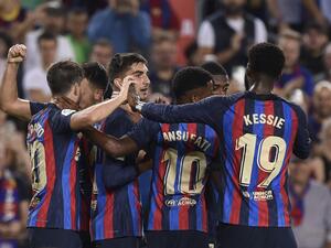 Barcelona's Spanish forward Ferran Torres celebrates scoring his team's fourth goal with teammates during the Spanish league football match between FC Barcelona and Athletic Club Bilbao at the Camp Nou stadium in Barcelona, on October 23, 2022. (Photo by Josep LAGO / AFP)