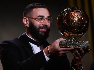 Real Madrid's French forward Karim Benzema receives the Ballon d'Or award during the 2022 Ballon d'Or France Football award ceremony at the Theatre du Chatelet in Paris on October 17, 2022. (Photo by FRANCK FIFE / AFP)