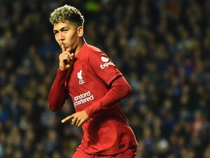 Liverpool's Brazilian striker Roberto Firmino celebrates scoring his team's first goal during the UEFA Champions League Group A football match between Glasgow Rangers and Liverpool at the Ibrox Stadium, in Glasgow, on October 12, 2022. (Photo by ANDY BUCHANAN / AFP)