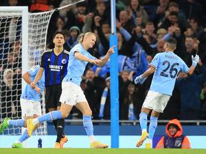 Manchester City's Norwegian striker Erling Haaland celebrates after scoring his team first goal during the UEFA Champions League group G football match between Manchester City and FC Copenhagen at the Etihad Stadium in Manchester, north west England on October 5, 2022. (Photo by Lindsey Parnaby / AFP)