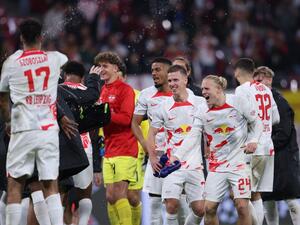 Leipzig's players celebrate after winning the UEFA Champions League Group F football match between RB Leipzig and Real Madrid CF in Leipzig, eastern Germany on October 25, 2022. (Photo by Ronny HARTMANN / AFP)