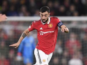 Manchester United's Portuguese midfielder Bruno Fernandes runs with the ball during the UEFA Europa League Group E football match between Manchester United and Omonoia Nicosia, at Old Trafford stadium, in Manchester, north-west England, on October 13, 2022. (Photo by Oli SCARFF / AFP)