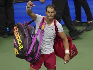 Spain's Rafael Nadal waves as he leaves the court after being defeated by USA's Frances Tiafoe during a 2022 US Open Tennis tournament men's singles Round of 16 match at the USTA Billie Jean King National Tennis Center in New York on September 5, 2022. (Photo by KENA BETANCUR / AFP)