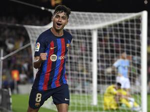 Barcelona's Spanish midfielder Pedri celebrates scoring the opening goal during the Spanish League football match between Barcelona FC and RC Celta de Vigo at the Camp Nou stadium in Barcelona on October 9, 2022. (Photo by Josep LAGO / AFP)
