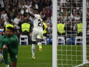 Real Madrid's Brazilian forward Vinicius Junior celebrates scoring his team's first goal during the Spanish league football match between Real Madrid CF and Girona FC at the Santiago Bernabeu stadium in Madrid on October 30, 2022. (Photo by PIERRE-PHILIPPE MARCOU / AFP)
