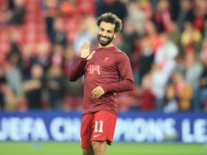 Liverpool's Egyptian striker Mohamed Salah waves to supporters prior to the UEFA Champions League group A football match between Liverpool and Ajax at Anfield in Liverpool, north west England on September 13, 2022. (Photo by Lindsey Parnaby / AFP)