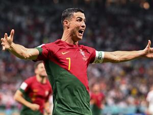 Portugal's forward #07 Cristiano Ronaldo celebrates scoring his team's first goal during the Qatar 2022 World Cup Group H football match between Portugal and Uruguay at the Lusail Stadium in Lusail, north of Doha on November 28, 2022. FIFA later attributed the goal to Portugal's midfielder #08 Bruno Fernandes. (Photo by Kirill KUDRYAVTSEV / AFP)