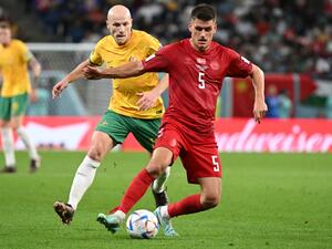 Australia's midfielder #13 Aaron Mooy (L) and Denmark's defender #05 Joakim Maehle fight for the ball during the Qatar 2022 World Cup Group D football match between Australia and Denmark at the Al-Janoub Stadium in Al-Wakrah, south of Doha on November 30, 2022. (Photo by NATALIA KOLESNIKOVA / AFP)