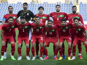 Players of Iran pose for a team photo prior to the friendly football match between Iran and Uruguay in Sankt Poelten, Austria on September 23, 2022. (Photo by Alex HALADA / AFP)