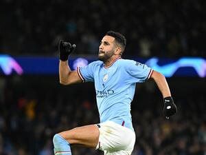 Manchester City's Algerian midfielder Riyad Mahrez celebrates scoring his team's third goal during the UEFA Champions League group G football match between Manchester City and Sevilla at the Etihad Stadium in Manchester, north west England on November 2, 2022. (Photo by Oli SCARFF / AFP)
