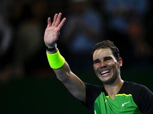 Spanish tennis player Rafael Nadal acknowledges the crowd during an exhibition match against Norwegian tennis player Casper Ruud on November 23, 2022, at Roca park in Buenos Aires. (Photo by Luis ROBAYO / AFP)