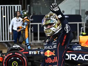 Red Bull's Dutch driver Max Verstappen waves to the crows after the qualifying session on the eve of the Abu Dhabi Formula One Grand Prix at the Yas Marina Circuit in the Emirati city of Abu Dhabi on November 19, 2022. (Photo by Ben Stansall / AFP)