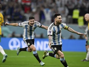 Argentina's forward #10 Lionel Messi (2ndR) celebrates with Argentina's forward #09 Julian Alvarez after he scored his team's first goal during the Qatar 2022 World Cup round of 16 football match between Argentina and Australia at the Ahmad Bin Ali Stadium in Al-Rayyan, west of Doha on December 3, 2022. (Photo by Alfredo ESTRELLA / AFP)