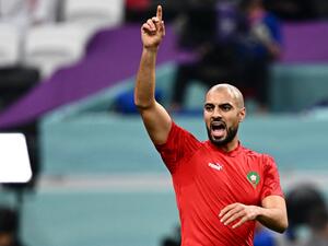 Morocco's midfielder #04 Sofyan Amrabat warms up ahead of the Qatar 2022 World Cup semi-final football match between France and Morocco at the Al-Bayt Stadium in Al Khor, north of Doha on December 14, 2022. (Photo by GABRIEL BOUYS / AFP)