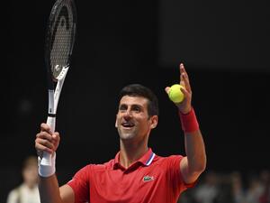 Serbia's Novak Djokovic celebrates defeating Austria's Sebastian Ofner during the 2022 World Tennis League exhibition match at Dubai’s Coca-Cola arena in the United Arab Emirates, on December 23, 2022. (Photo by Ryan LIM and Ryan LIM / AFP)